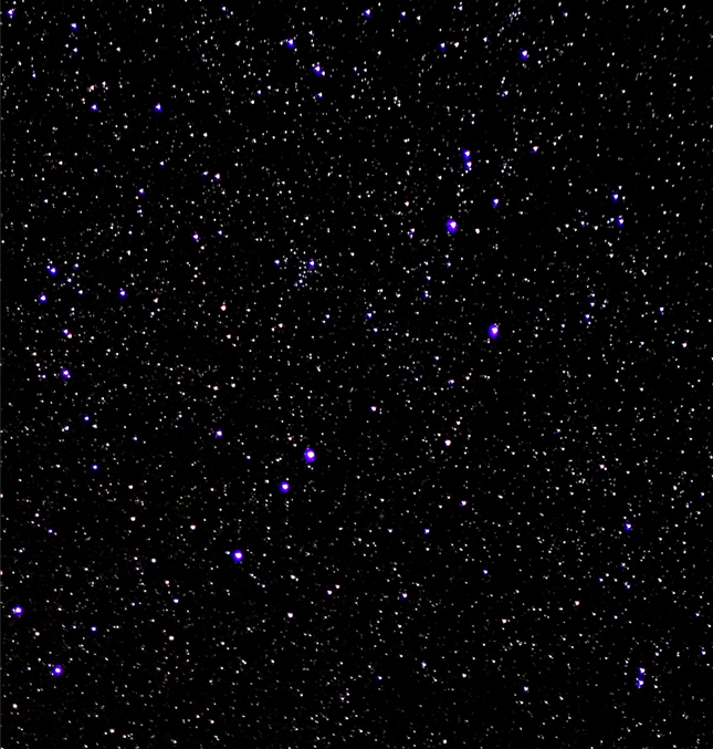 Black space with countless silver, white, blue and purple stars.